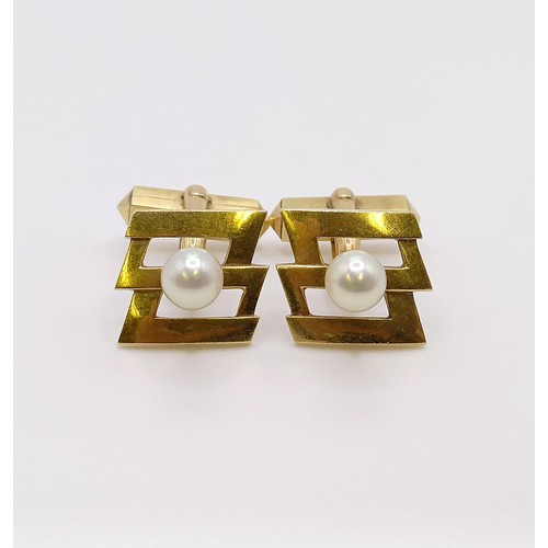 593 - A pair of 14ct gold and Mikimoto pearl cufflinks