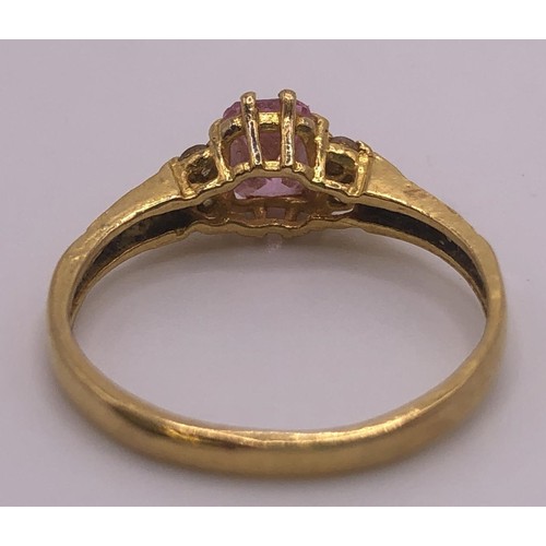 595 - An 18ct gold and pink sapphire ring, ring size J