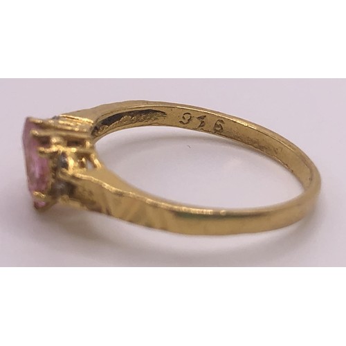 595 - An 18ct gold and pink sapphire ring, ring size J