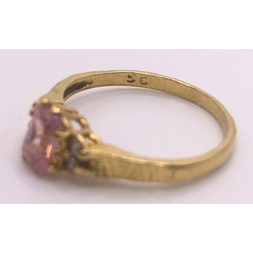 595 - An 18ct gold and pink sapphire ring, ring size J