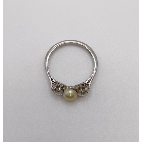 597 - An 18ct white gold, diamond and cultured pearl ring, ring size N