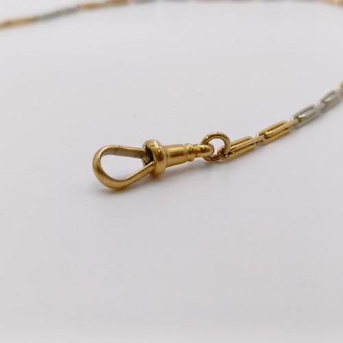 600 - An 18ct white and yellow gold chain, with a yellow metal pendant, all in 13.7 g