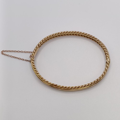 601 - A 15ct gold bangle, 8.7 g