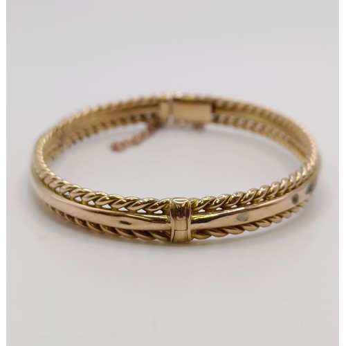 601 - A 15ct gold bangle, 8.7 g