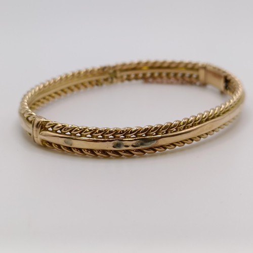 601 - A 15ct gold bangle, 8.7 g