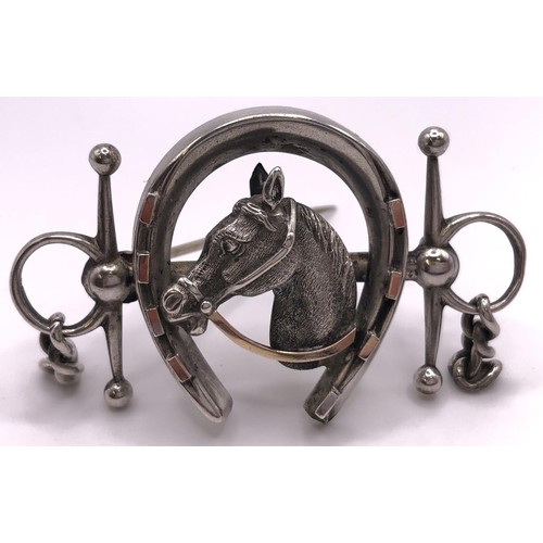 603 - A silver brooch, in the form of a horse head within a horseshoe and a bit, and a floral silver brooc... 