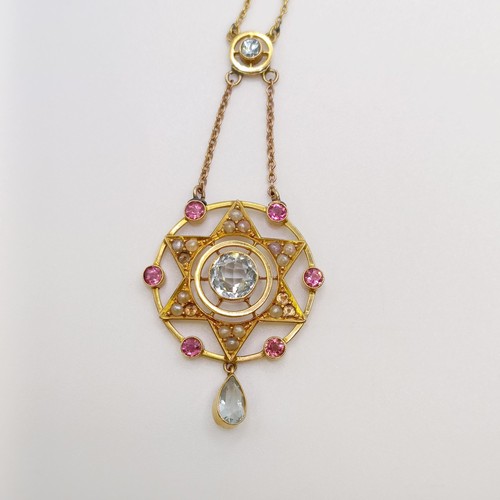 605 - A 15ct gold, aquamarine, pink stone and seed pearl pendant, on a chain