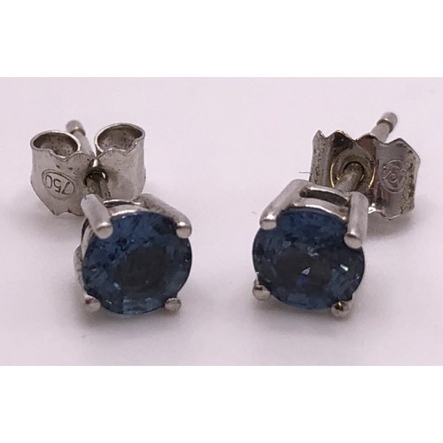 610 - A pair 18ct gold of light blue stone stud earrings