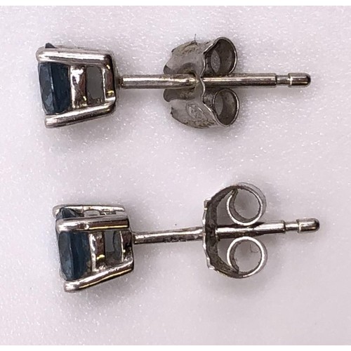 610 - A pair 18ct gold of light blue stone stud earrings