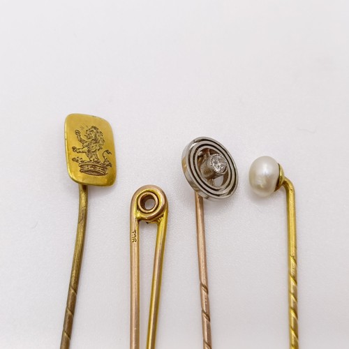 612 - A 9ct gold and diamond stick pin, a bar brooch, and two stick pins (4)