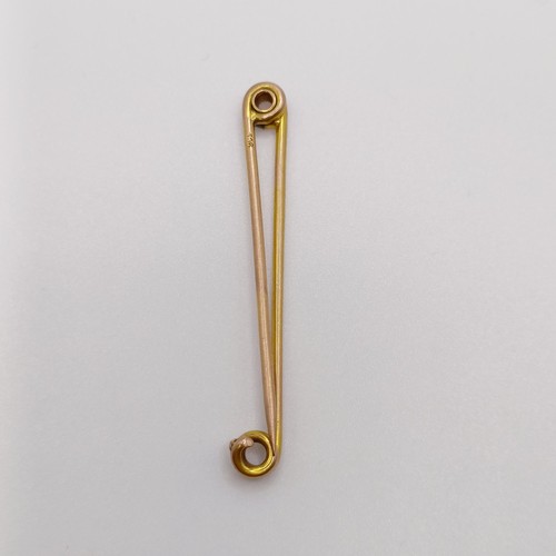 612 - A 9ct gold and diamond stick pin, a bar brooch, and two stick pins (4)