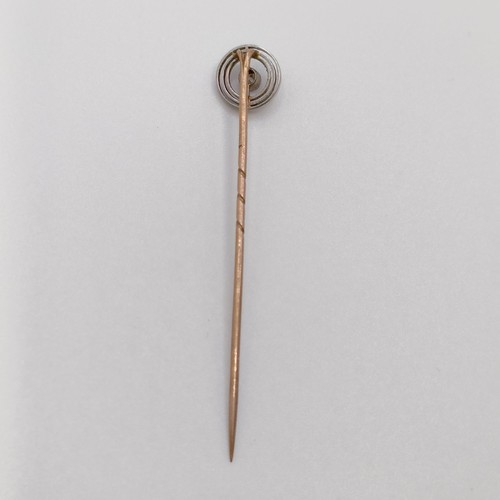 612 - A 9ct gold and diamond stick pin, a bar brooch, and two stick pins (4)