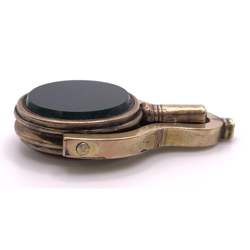 616 - A 19th century gilt metal and hardstone seal/watch key