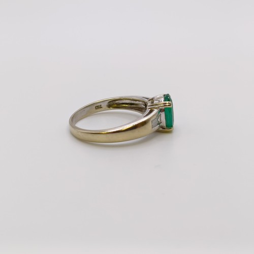 617 - An 18ct gold, emerald and diamond ring, ring size L