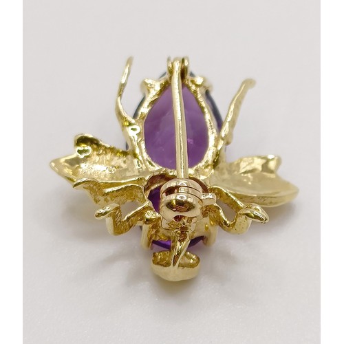 623 - A 14ct gold and amethyst bee brooch