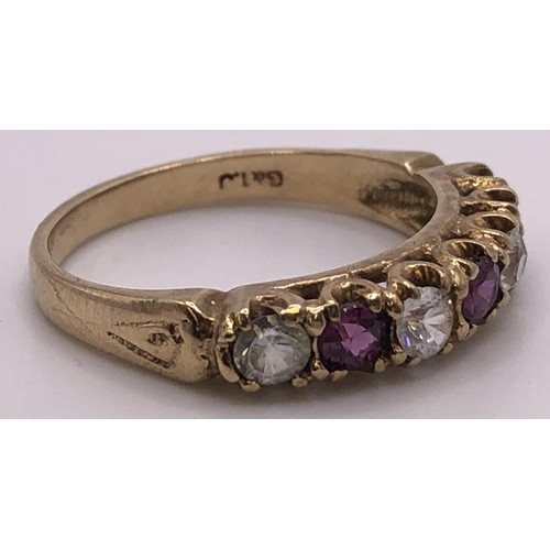 628 - A 9ct gold, garnet and white stone ring, ring size M