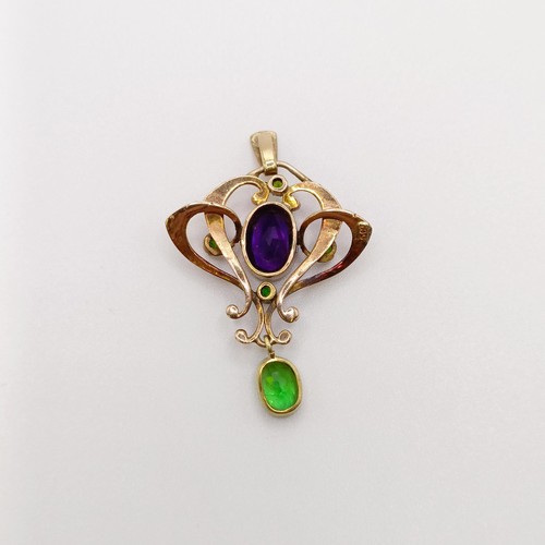 633 - An Art Nouveau 9ct gold and multi-coloured stone pendant