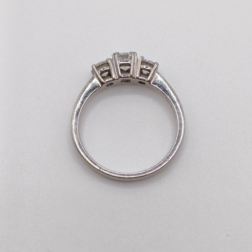 637 - A lab grown diamond three stone ring, central stone 0.5ct