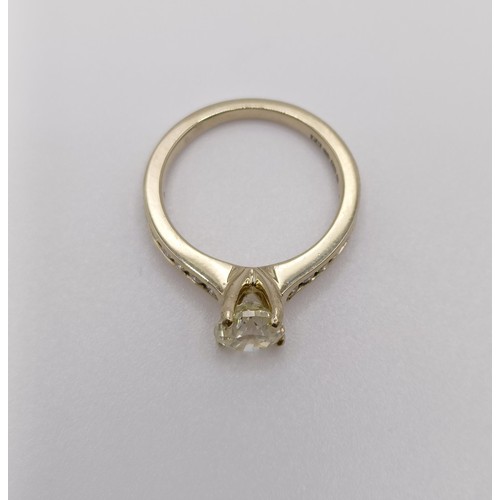 639 - An 18ct gold and diamond solitaire ring, approx. 1.1ct, with diamond set shoulders, ring size I