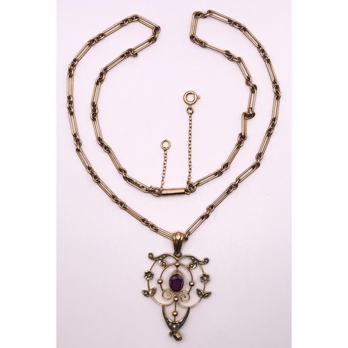 640 - An early 20th century, yellow metal, purple stone and seed pearl pendant, on a 9ct gold chain, all i... 