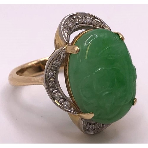 641 - A 9ct gold, diamond and carved jade ring, ring size M