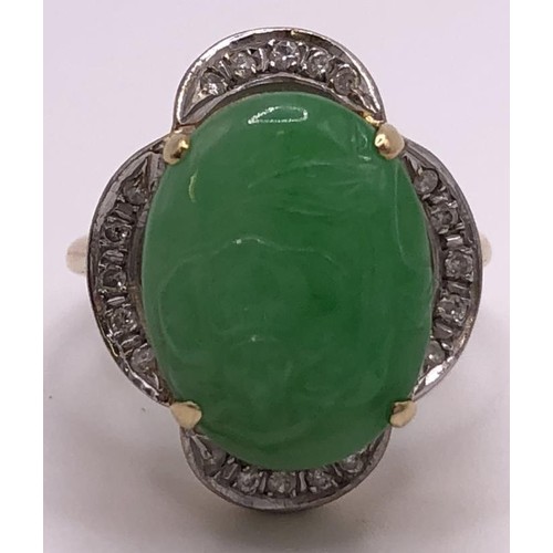 641 - A 9ct gold, diamond and carved jade ring, ring size M