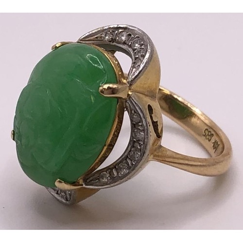 641 - A 9ct gold, diamond and carved jade ring, ring size M