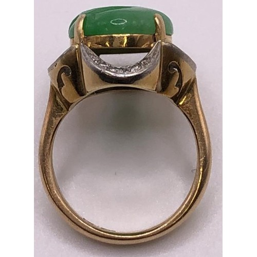 641 - A 9ct gold, diamond and carved jade ring, ring size M