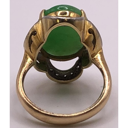 641 - A 9ct gold, diamond and carved jade ring, ring size M