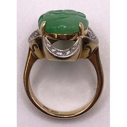 641 - A 9ct gold, diamond and carved jade ring, ring size M