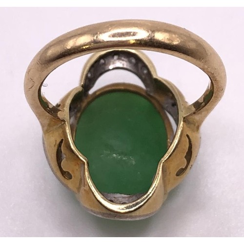 641 - A 9ct gold, diamond and carved jade ring, ring size M