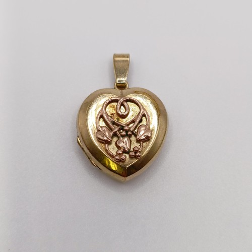 649 - A 9ct gold heart shaped locket, 5.6 g all in