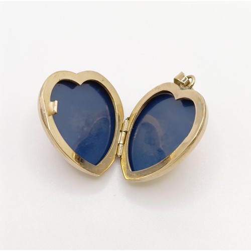 649 - A 9ct gold heart shaped locket, 5.6 g all in