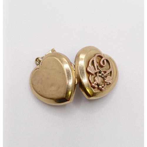 649 - A 9ct gold heart shaped locket, 5.6 g all in