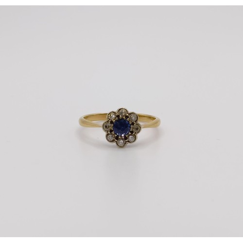 654 - An 18ct gold, diamond and sapphire flowerhead ring, ring size J