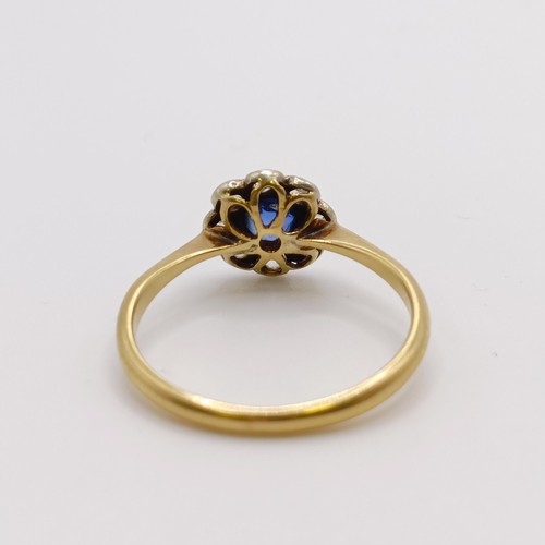 654 - An 18ct gold, diamond and sapphire flowerhead ring, ring size J