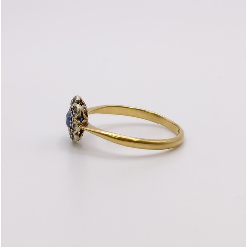 654 - An 18ct gold, diamond and sapphire flowerhead ring, ring size J