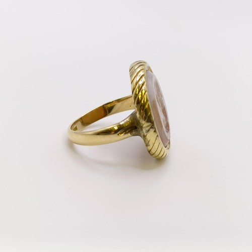 656 - An 18ct gold and carved hardstone intaglio ring, ring size G