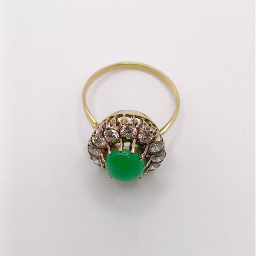 658 - An 18ct gold, diamond and Chinese greenstone ring, ring size M