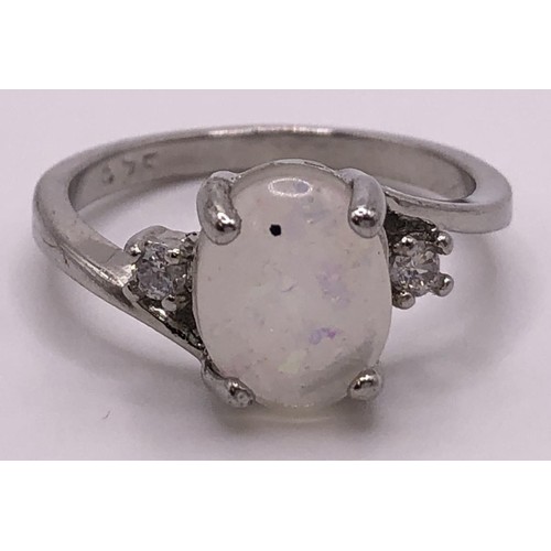 665 - A Sarah Cov dress ring, a silver and opal dress ring, and a bracelet (3)