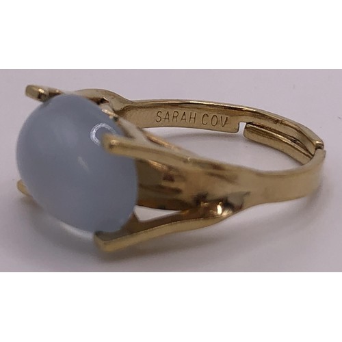 665 - A Sarah Cov dress ring, a silver and opal dress ring, and a bracelet (3)