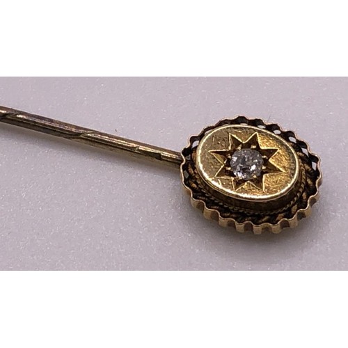 666 - An early 20th century 15ct gold and diamond stick pin, cased