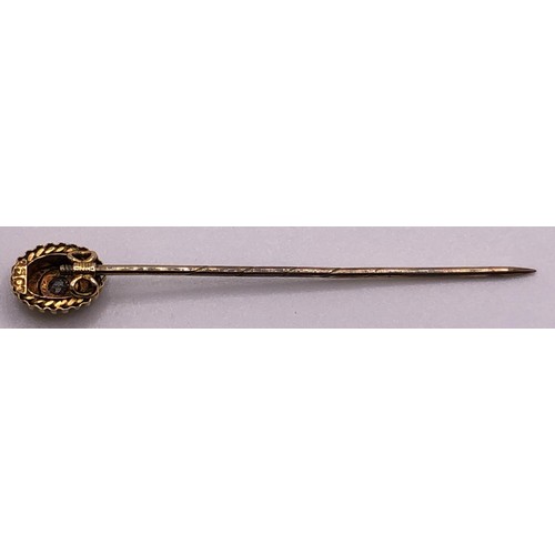 666 - An early 20th century 15ct gold and diamond stick pin, cased