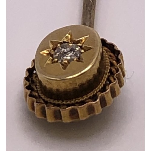 666 - An early 20th century 15ct gold and diamond stick pin, cased