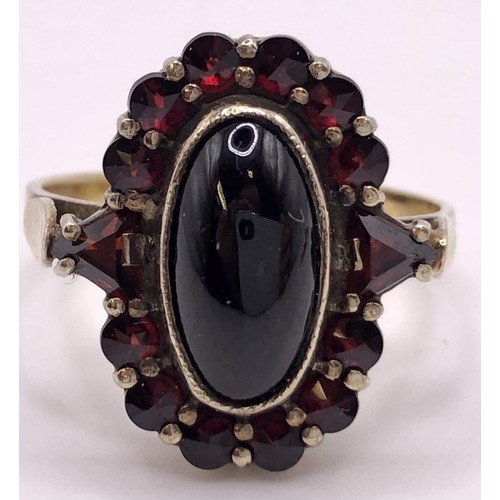 667 - A 9ct gold and cabochon garnet cluster ring, ring size L, and a similar pair of earrings (3)