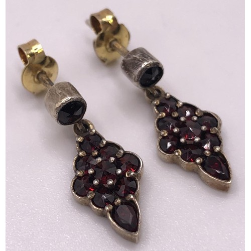 667 - A 9ct gold and cabochon garnet cluster ring, ring size L, and a similar pair of earrings (3)