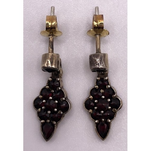 667 - A 9ct gold and cabochon garnet cluster ring, ring size L, and a similar pair of earrings (3)