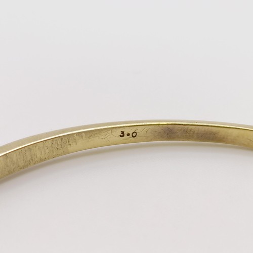 669 - A yellow metal and diamond bangle, diamond weight approx. 3ct