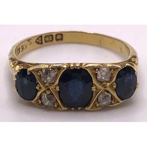 670 - An 18ct gold, sapphire and diamond ring, ring size S