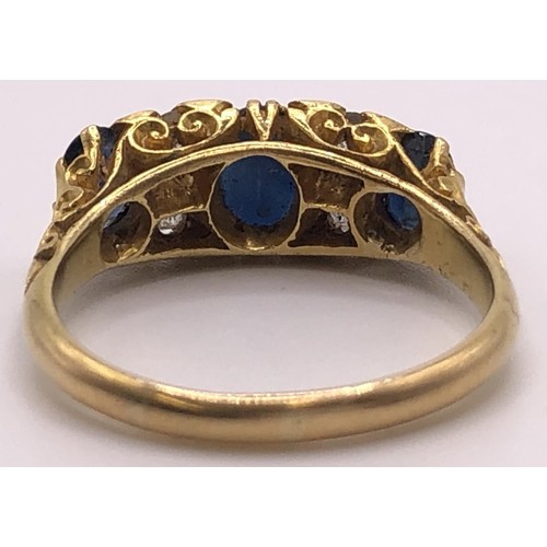 670 - An 18ct gold, sapphire and diamond ring, ring size S